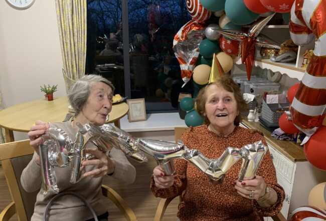 Residents and team members celebrate the new year at Abbey Wood Lodge